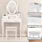 Elegant Vanity Table with Rotating Mirror, 4 Drawers, and Cushioned Stool