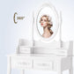 Elegant Vanity Table with Rotating Mirror, 4 Drawers, and Cushioned Stool